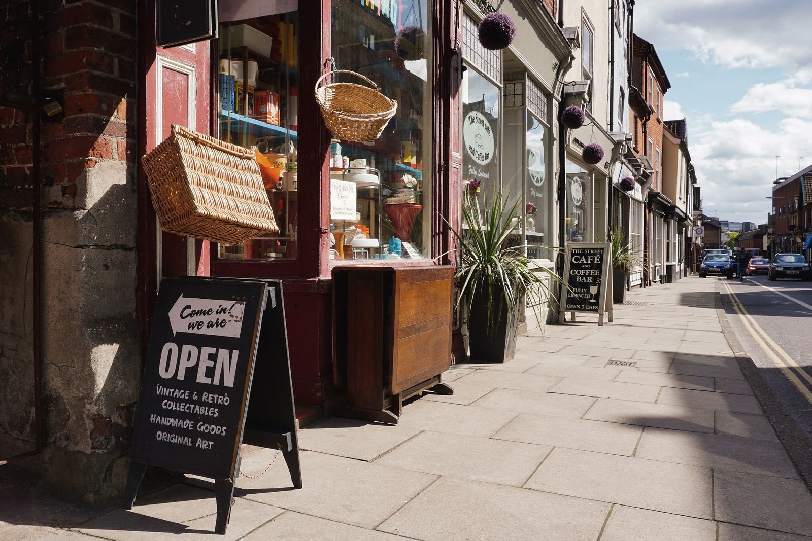 A street of small independent shops and a café
