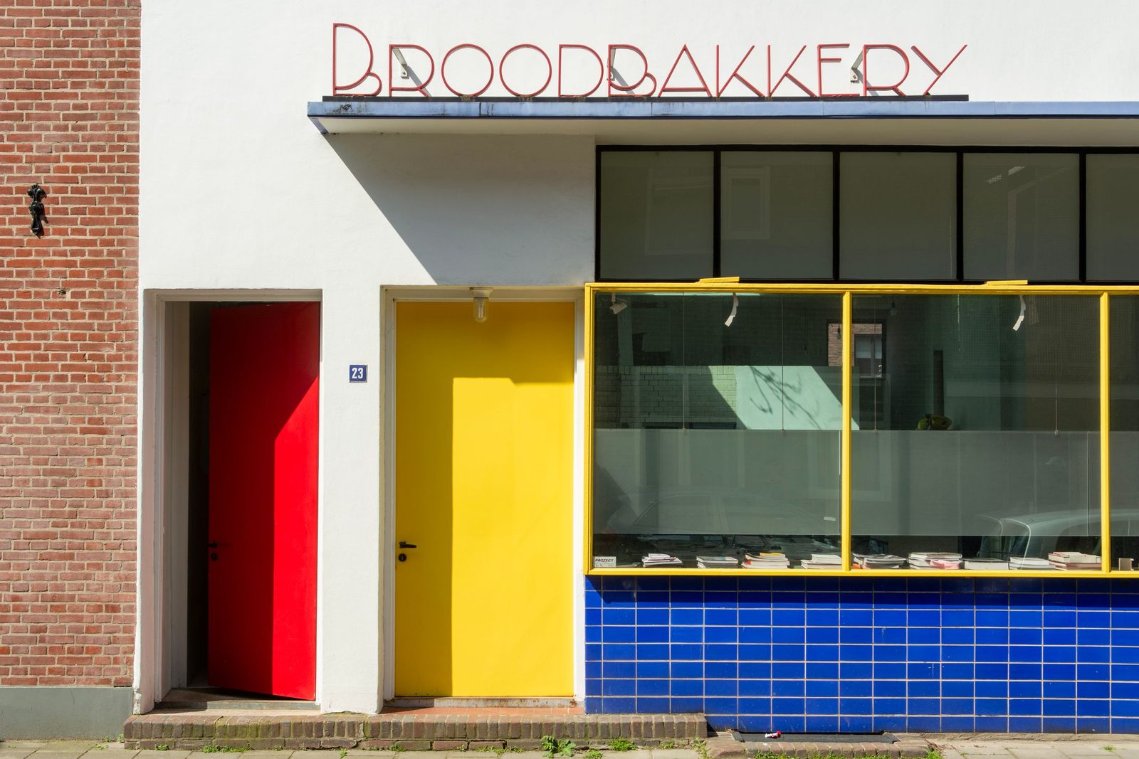The front of a bakery with brightly coloured doors