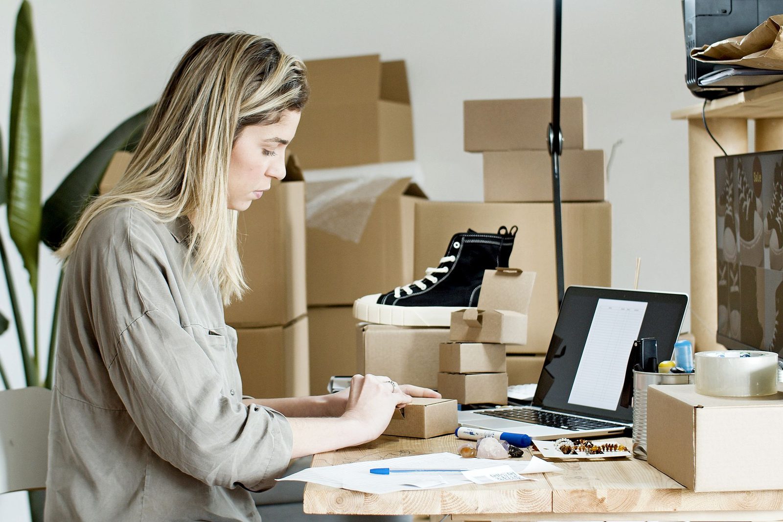 A woman packing orders for her online shop