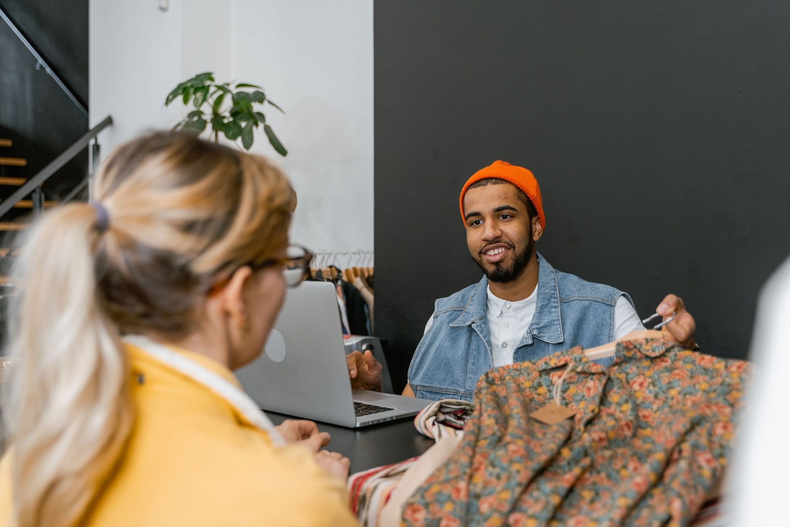 A boutique owner chatting with a customer