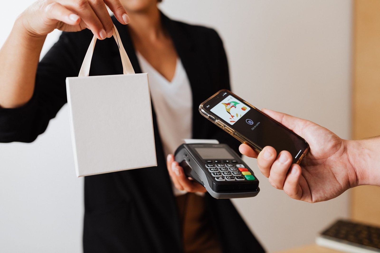 A phone held to a card reader for a contactless payment